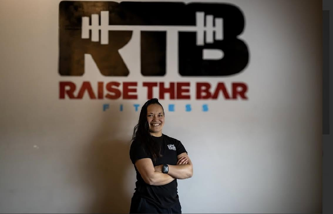 Coach JJ smiling at Raise the Bar Fitness in Moncton